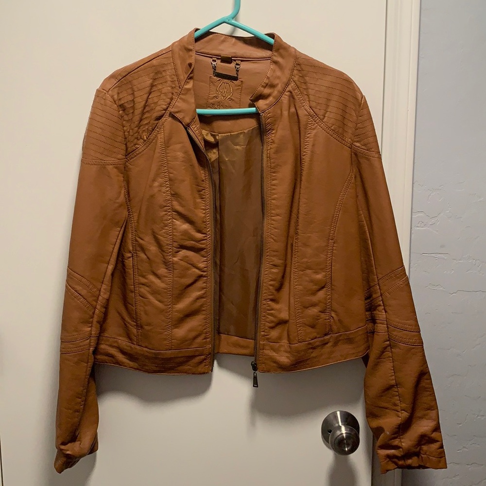 Light brown/orangey faux leather jacket.